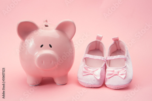 Photo: Piggy bank and baby booties Piggy bank and baby booties