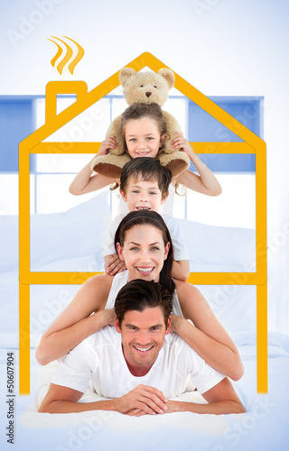 Photo: Smiling family leaning on each others shoulders in bed Smiling family leaning on each others shoulders in bed