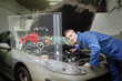 Mechanic with open hood consulting interface