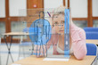Photo: Blonde woman thinking hard while studying on interface with body Blonde woman thinking hard while studying on interface with body