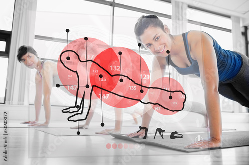 Photo: Women using red interface at the gym Women using red interface at the gym