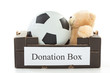 Black cardboard with football and stuffed bear