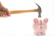 Hammer breaking piggy bank