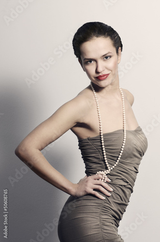 Photo: Young woman in elegant dress Young woman in elegant dress