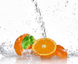 Oranges with splashing water
