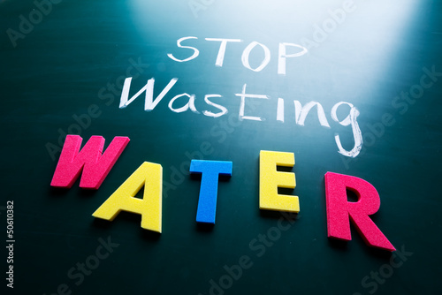 Photo: Stop wasting water concept Stop wasting water concept