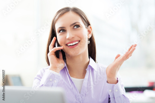 Photo: Young businesswoman with laptop Young businesswoman with laptop