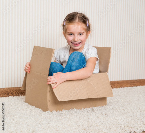 Photo: girl inside a box girl inside a box