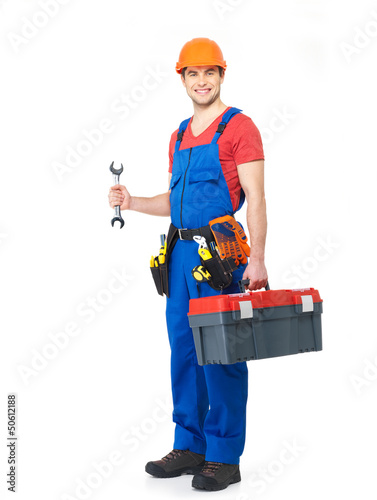 Photo: Worker with tools full portrait isolated Worker with tools full portrait isolated