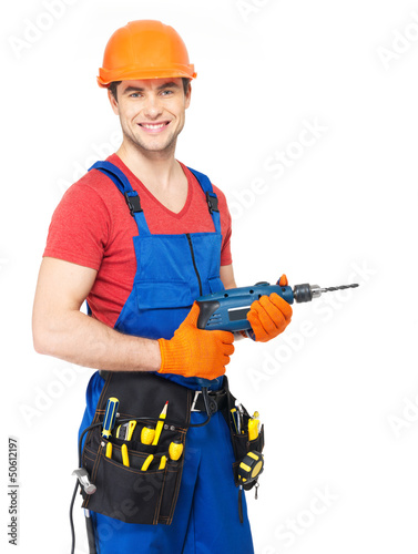 Photo: Portrait of smiling handyman with tools Portrait of smiling handyman with tools