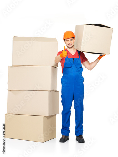 Photo: Delivery man with paper boxes and thumbs up sign Delivery man with paper boxes and thumbs up sign