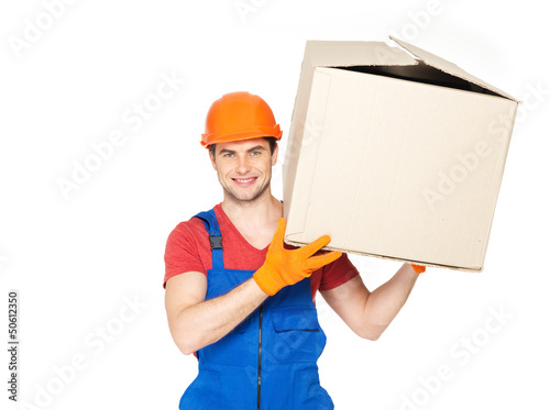 Photo: handsome young delivery man with paper boxes handsome young delivery man with paper boxes