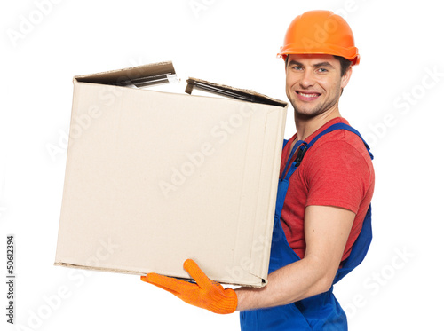 Photo: handsome young delivery man with paper boxes handsome young delivery man with paper boxes
