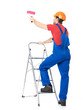 Photo: Craftsman painter stands on the stairs Craftsman painter stands on the stairs