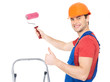 Photo: Craftsman painter stands on the stairs with roller Craftsman painter stands on the stairs with roller