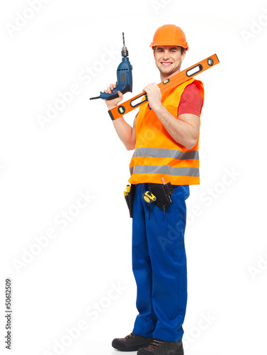 Photo: Smiling workman with tools in uniform Smiling workman with tools in uniform