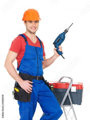 Photo: Portrait of manual worker with tools Portrait of manual worker with tools