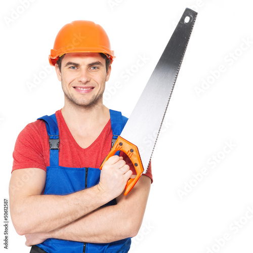 Photo: smiling manual worker with saw smiling manual worker with saw