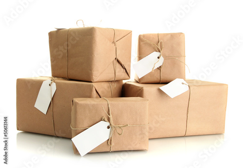 Photo: parcels boxes with kraft paper, isolated on white parcels boxes with kraft paper, isolated on white