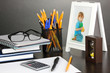 White photo frame on office desk on grey background