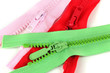 Multicolored zippers isolated on white