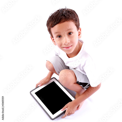 Photo: Boy playing on tablet Boy playing on tablet