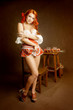 Red hair woman with two glass of beer stand
