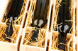 Wooden case with wine bottles close up