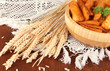 Appetizing village potatoes in bowl on wooden table close-up