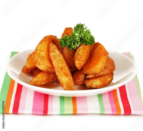Photo: Appetizing village potatoes on plate isolated on white Appetizing village potatoes on plate isolated on white