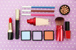 Decorative cosmetics on purple background