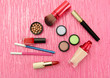 Decorative cosmetics on pink background