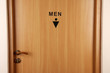 Toilet sign on wooden door