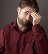 Forty years old confused man scratching his head