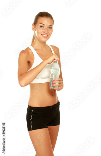 Photo: Woman in sportswear with bottle of water Woman in sportswear with bottle of water