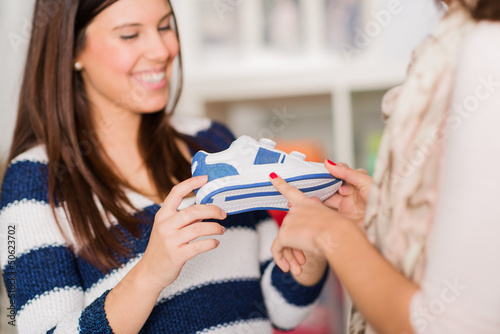 Photo: Two Women Buying Shoes Two Women Buying Shoes