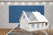 Modellhaus Einfamilienhaus vor Blaupapier