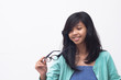 beautiful asian girl checking her new glasses