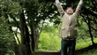 Happy mature business man expressing success. Outdoors.