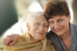 Photo: Portrait of happy old grandmother with daughter. Portrait of happy old grandmother with daughter.