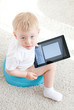 little boy on the chamder with tablet pc