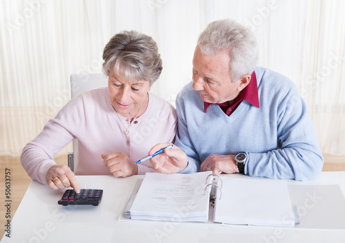 Photo: Senior Couple Calculating Budget Senior Couple Calculating Budget