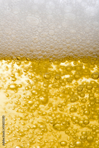 Photo: Beer close up bubbling Beer close up bubbling