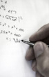 Young man doing the maths homework
