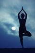 Photo: Woman in yoga Tree pose, full moon night Woman in yoga Tree pose, full moon night