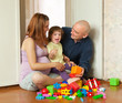 Happy family plays in home