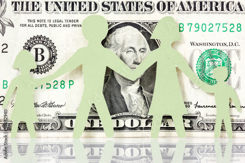 Photo: Paper family on the one dollar background Paper family on the one dollar background