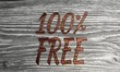 100 percent free symbol in a wooden background