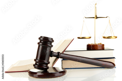 Photo: Golden scales of justice, gavel and books isolated on white Golden scales of justice, gavel and books isolated on white