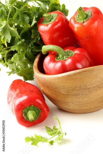 Photo: Fresh ripe red bell paprika peppers and parsley Fresh ripe red bell paprika peppers and parsley